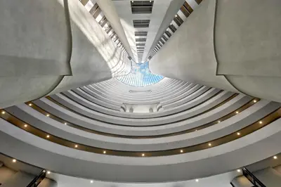 a view of a building with a spiral staircase at The Atrium at Jalan Ampang by OKBnB - Modern 2Bedroom, 10 mins to Pavilion KL in Kuala Lumpur