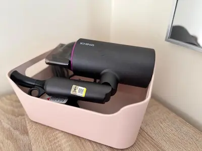 a black sewing machine sitting in a box at Peaceful 3BR 2B with Pool 10pax Wangsa Maju near Wangsa Walk in Kuala Lumpur