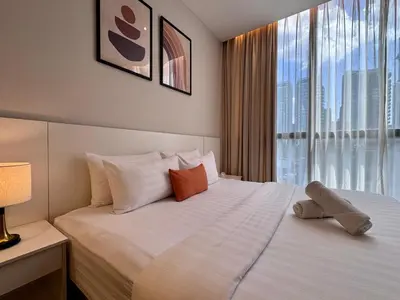 a bedroom with a large white bed with a window at NEW Bangsar Trade Centre KL Mid Valley LRT Bangsar in Kuala Lumpur