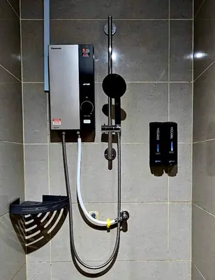 a shower in a bathroom with a shower at NEW Bangsar Trade Centre KL Mid Valley LRT Bangsar in Kuala Lumpur