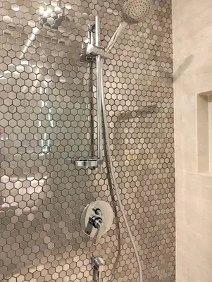 a shower in a bathroom with a tiled wall at STAR Residences Home Stay Near By KLCC in Kuala Lumpur