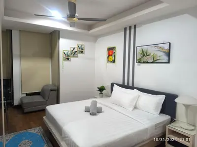 a bedroom with a white bed with a ceiling fan at 0186 Sweet Home-Casa Residency 1R 1B in Kuala Lumpur