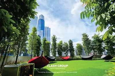 a park with two hammocks and a grass field at Agile Bukit Bintang Premium Suites at KLCC in Kuala Lumpur