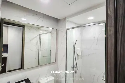 a bathroom with a shower and a mirror at Agile Bukit Bintang Premium Suites at KLCC in Kuala Lumpur