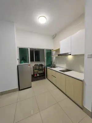 a large kitchen with white cabinets and appliances at DUDUhomes in Kuala Lumpur