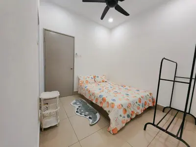 a bedroom with a bed and a ceiling fan at Razak City Residences dudu in Kuala Lumpur