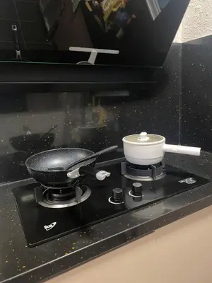 a pot on a stove with a bowl on it at Razak City Residences dudu in Kuala Lumpur