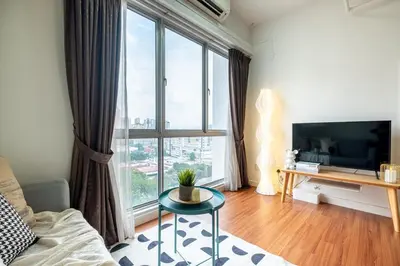 a living room with a large window and a tv at Menara Arina Uniti 3km to KLCC 2BR 4Pax Mini Home in Kuala Lumpur