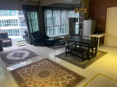 a living room with a black table and chairs at Skypool KL Free Infinity Pool over Kuala Lumpur in Kuala Lumpur