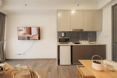 a small kitchen with a counter and a microwave at Agile Bukit Bintang KLCC by DX in Kuala Lumpur