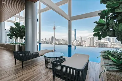 a balcony with a view of the city at LUXE Infinitum KLCC by DX in Kuala Lumpur