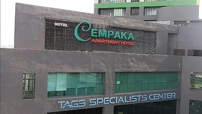 a building with a sign on the side of it at 103 Hotel in Kuala Lumpur