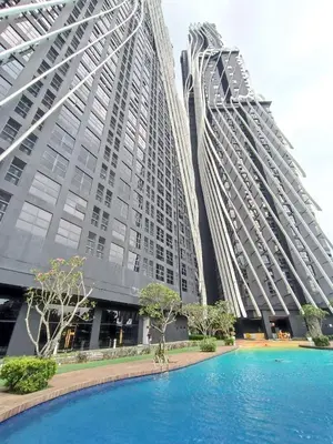 two tall buildings with a pool in front of them at Arte Mont Kiara 4BR 8pax-10pax, 10mins to KLCC in Kuala Lumpur