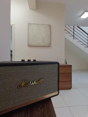 a television in a room with a picture on the wall at Arte Mont Kiara 4BR 8pax-10pax, 10mins to KLCC in Kuala Lumpur