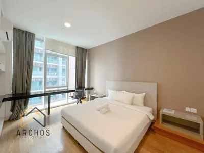a bedroom with a white bed and a large window at The Platinum KLCC by Archos in Kuala Lumpur