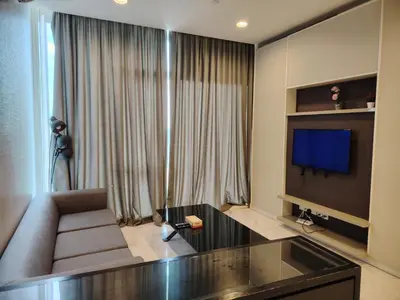 a living room with a couch and a flat screen tv at Platinum Kuala Lumpur by Sleepy Owl Suites in Kuala Lumpur
