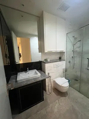 a bathroom with a sink and a toilet and a shower at Platinum Kuala Lumpur by Sleepy Owl Suites in Kuala Lumpur