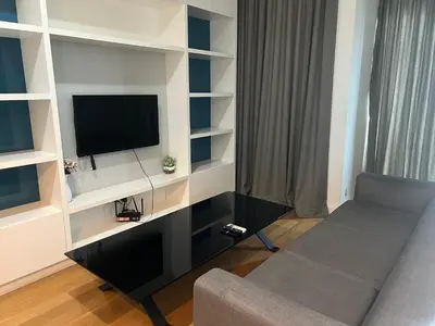 a living room with a tv and a couch at Platinum Kuala Lumpur by Sleepy Owl Suites in Kuala Lumpur
