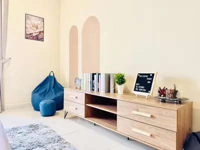 a bedroom with a wooden dresser and a bed at KL TRX view # IKEA MRT # 2 BED 2BATH # Continew KL in Kuala Lumpur