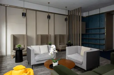 a living room with two chairs and a table at Agile Bukit Bintang by KAN's in Kuala Lumpur