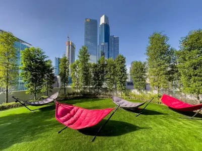 three hammocks in a grassy yard in a city at Agile Bukit Bintang by KAN's in Kuala Lumpur