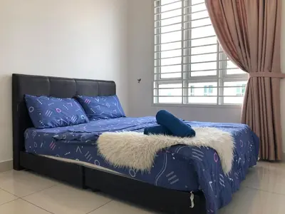 a bedroom with a bed with blue sheets and a window at Ampang 4-6 pax in Ampang Point in Ampang