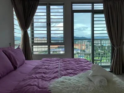 a bedroom with a purple bed with a large window at Ampang 4-6 pax in Ampang Point in Ampang