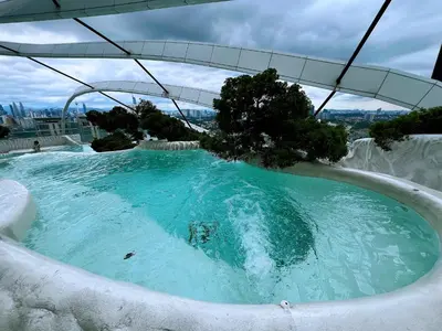 a large plunge pool with blue water in at Arte Mont Kiara 1-4 pax -MITEC-Kuala Lumpur by Infistay Homestay in Kuala Lumpur