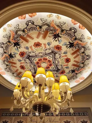 a chandelier hanging from a ceiling with a clock at Arte Mont Kiara 1-4 pax -MITEC-Kuala Lumpur by Infistay Homestay in Kuala Lumpur