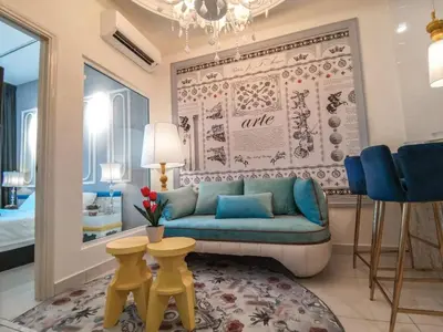 a living room with a blue couch and blue chairs at Arte Mont Kiara 1-4 pax -MITEC-Kuala Lumpur by Infistay Homestay in Kuala Lumpur