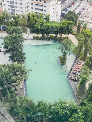 an overhead view of a large swimming pool in a city at Agile Sky Pavilion Residence KL TRX by Moonlight in Kuala Lumpur