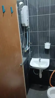 a bathroom with a sink and a toilet at Health Homestay KL in Kuala Lumpur