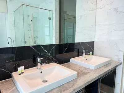 a bathroom with two sinks and a large mirror at XING LUN KLCC Platinum Suites in Kuala Lumpur