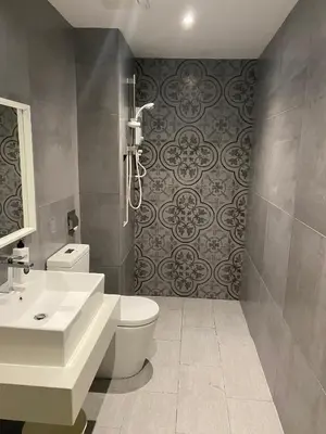 a bathroom with a toilet and a sink at Duplex Arte Mont Kiara modern design nice view in Kuala Lumpur