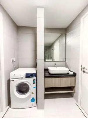 a bathroom with a washing machine and a sink at The Atrium at Jalan Ampang by OKBnB - Modern Stylish 2Bedroom with FREE WiFi and Carpark in Kuala Lumpur