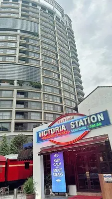 a restaurant in front of a large building at The Atrium at Jalan Ampang by OKBnB - Modern Stylish 2Bedroom with FREE WiFi and Carpark in Kuala Lumpur
