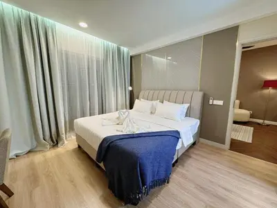 a bedroom with a large bed with a blue blanket at The Atrium at Jalan Ampang by OKBnB - Modern Stylish 2Bedroom with FREE WiFi and Carpark in Kuala Lumpur