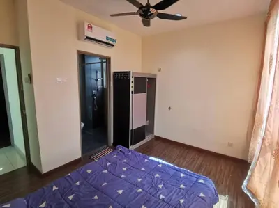 a bedroom with a purple bed and a ceiling fan at Zetapak homestay in Kuala Lumpur