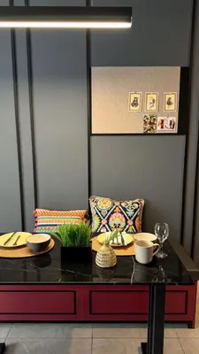 a table with plates and bowls on top of it at Just Stay Axon Residence Suite Bukit Bintang in Kuala Lumpur