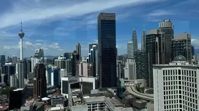 a view of a large city with tall buildings at Just Stay Axon Residence Suite Bukit Bintang in Kuala Lumpur