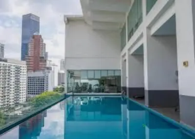 a swimming pool on the side of a building at 1Bukit ceylon view 118 in Kuala Lumpur