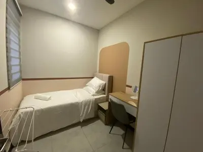 a small bedroom with a bed and a desk at KL City, Neu Suites 2Bedroom 1Bathroom in Kuala Lumpur
