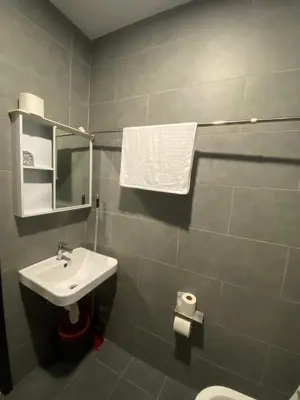 a bathroom with a sink and a toilet and a mirror at KL City, Neu Suites 2Bedroom 1Bathroom in Kuala Lumpur