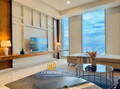 a living room with a bed and a glass table at Luxury Tropicana The Residence SkyPool KlccView CityCenter By HeyStay Management in Kuala Lumpur