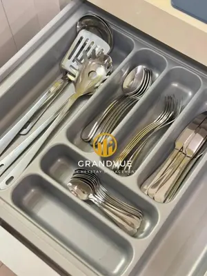 a sink with silver utensils in it at Luxury Tropicana The Residence SkyPool KlccView CityCenter By HeyStay Management in Kuala Lumpur