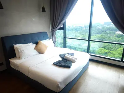 a bedroom with a white bed with a large window at 8Pax Green View next to KL118 ChinaTown n Train Station in Kuala Lumpur