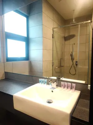 a bathroom with a sink and a shower at 8Pax Green View next to KL118 ChinaTown n Train Station in Kuala Lumpur