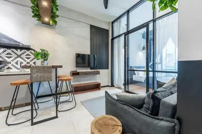 a living room with a couch and a tv at 6pax 2BR KL118 View 5min to train Station in Kuala Lumpur