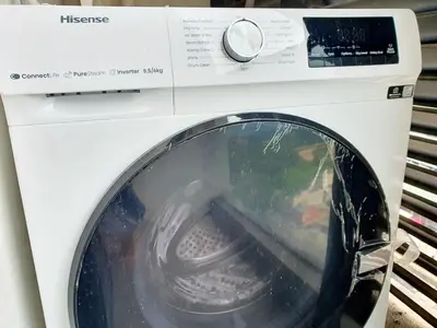 a white washing machine with its door open at The Establisment KL Sentral by GBS in Kuala Lumpur