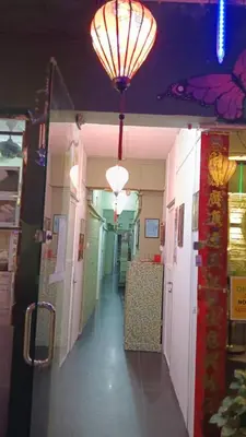 a hallway in a building with lights on the ceiling at Health Homestay KL in Kuala Lumpur